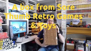 A box from Sore Thumb Retro Games & Toys