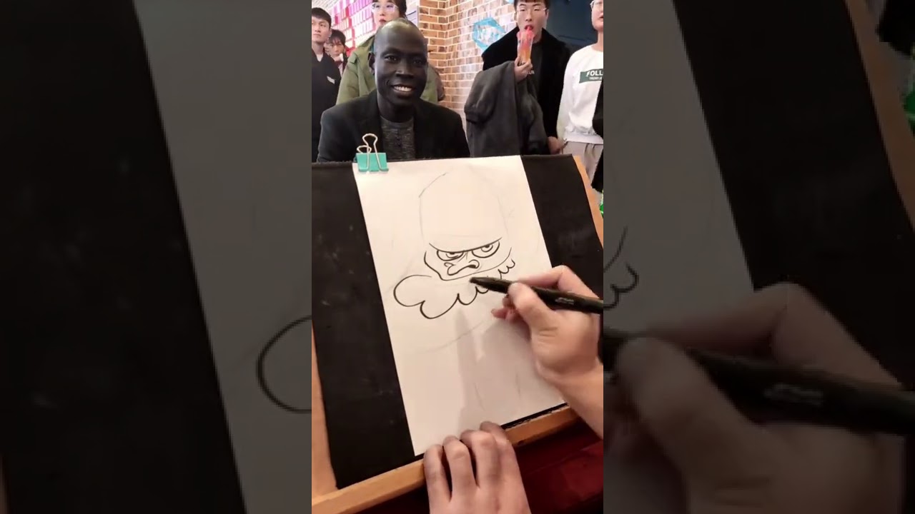 Funny cartoon portraits on the streets of China Black guy