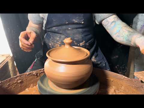 making a classic clay pot on a potter's wheel
