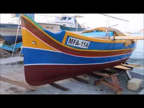 Varar ta' Luzzu w Kajjik f' Marsaxlokk/launching of traditional Maltese fishing  boats