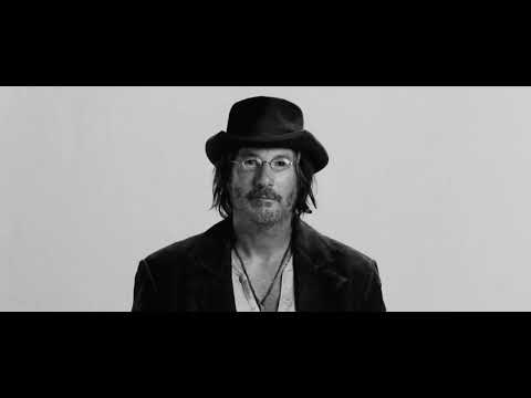 Trailer image: a reel-to-reel machine spinning as a voiceover flickers in