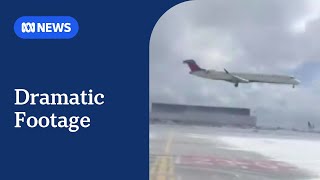 Moment Delta Air Lines plane rolls over on landing at Toronto airport | ABC NEWS
