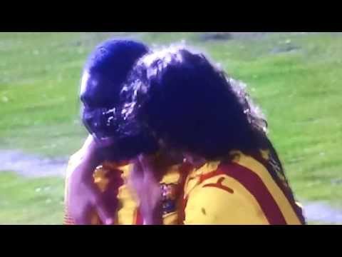 FC Barcelona's Puyol squeezing Dongou's face