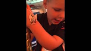 Alex rides the Merry go round