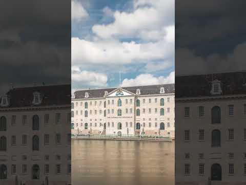 Hyperlapse of the National Maritime Museum with the sailboat replica Amsterdam docked nearby
