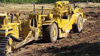 Caterpillar Pan Scrapers Excavating a Pond - Part 2- 7-26-11.wmv