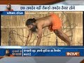 Swami Ramdev performs yoga with 90 sanyasis at Rishigram in Haridwar