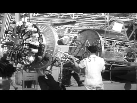 Workers at  Vultee Plant assembles Vultee BT-13 planes in Downey CA. HD Stock Footage