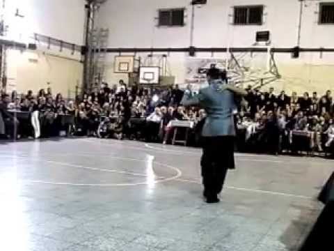  Jesica Arfenoni  and  Maximiliano Cristiani  are  dancing  to  a  tango