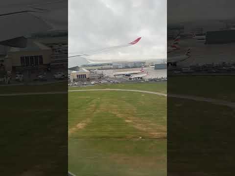 VS3 Virgin Atlantic from New York landing at a wet London Heathrow