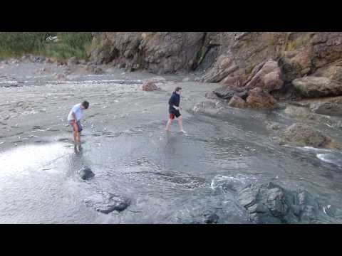 Celia reacts to catching a capelin with her hands
