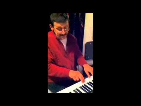 Miki Petkovski demonstrates to a student RCM piano song