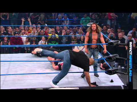 Who did Kurt Angle unmask? Who is part of Aces and 8s?