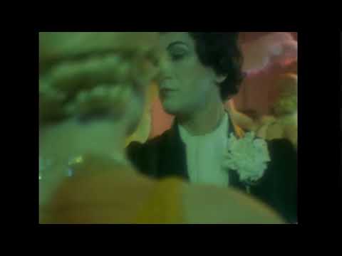 Trailer frame with backstage quick-changes; brass stabs and brushed drums implied
