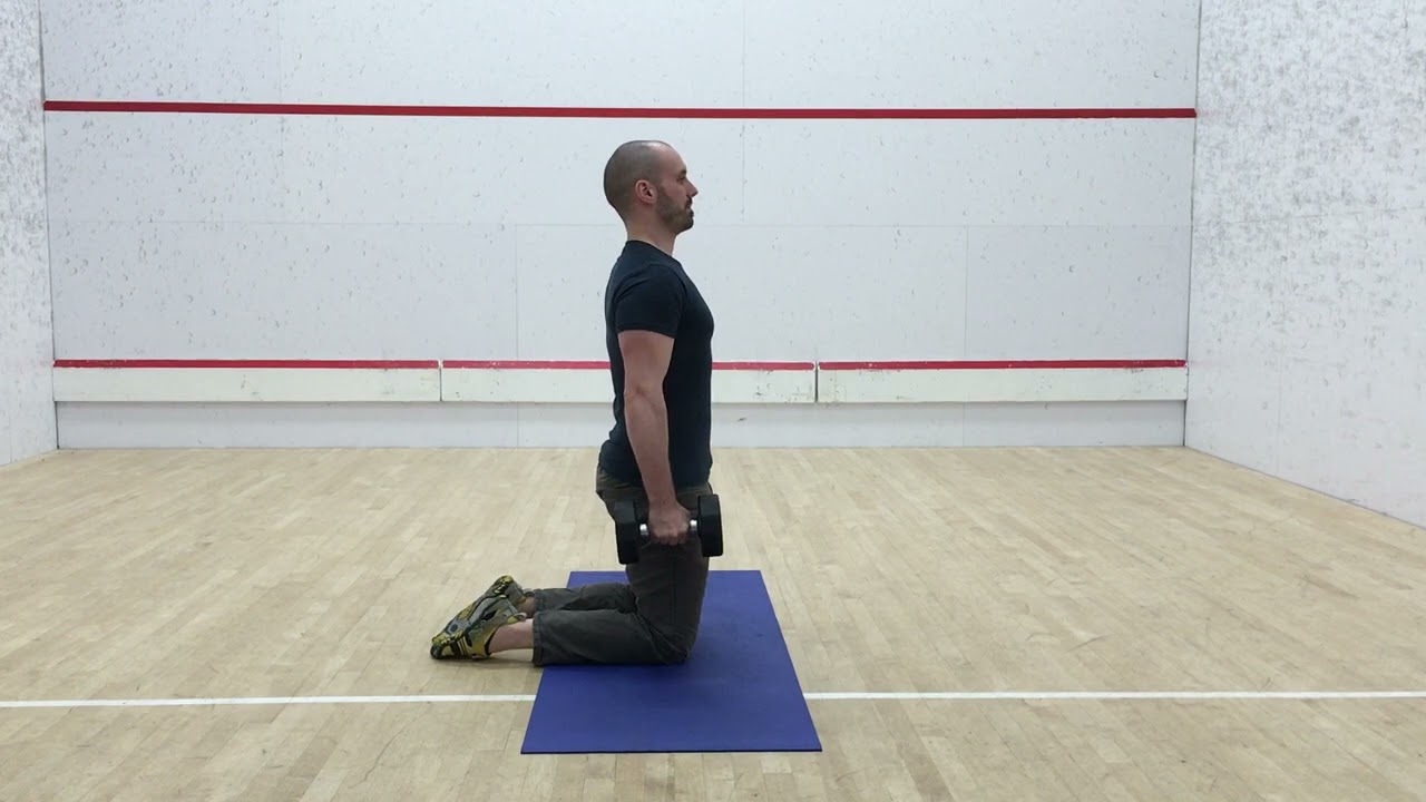 1. Tall Kneeling Suitcase Hold (Side View)