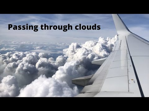 Airplane flying between clouds #shorts