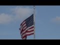 Flags from the USA and Texas waving in the breeze