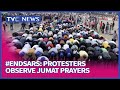 #EndSARS Protesters Observe Jumat Prayers In Alausa And Lekki, Lagos
