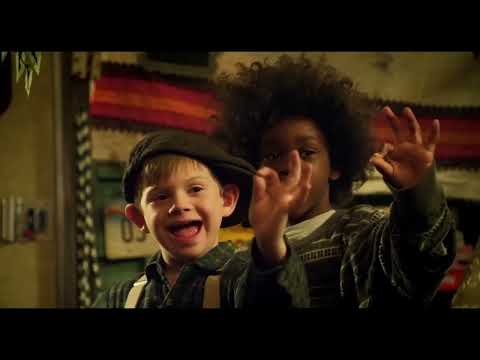 Quick-cut trailer montage: mixing bowl chaos, bike chases, and a stage spotlight while upbeat pop claps along