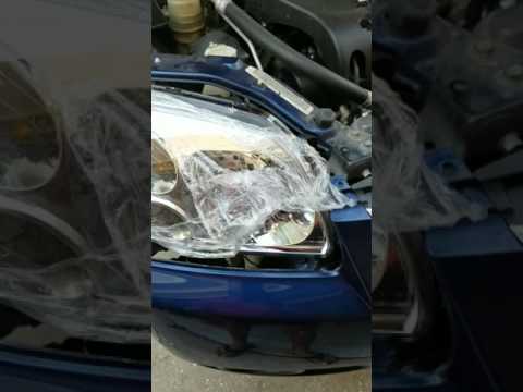 09 Mitsubishi galant head light removal and replace  part 2.