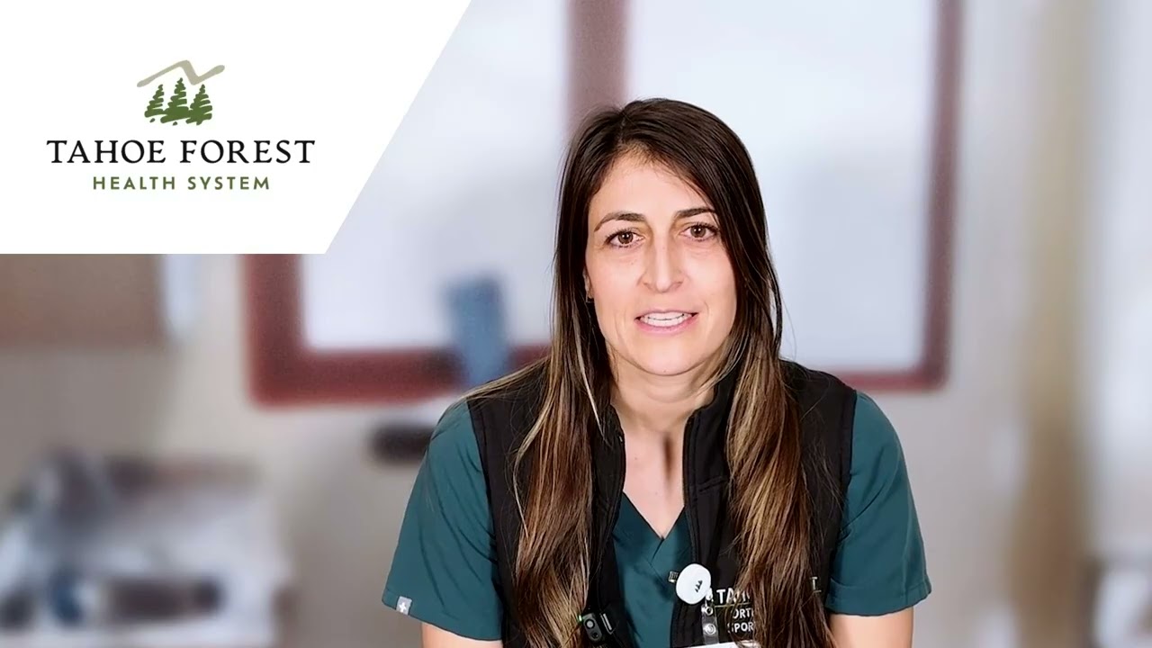 Dr. Whitney Liehr, sports medicine physician, sitting in front of a blurred window