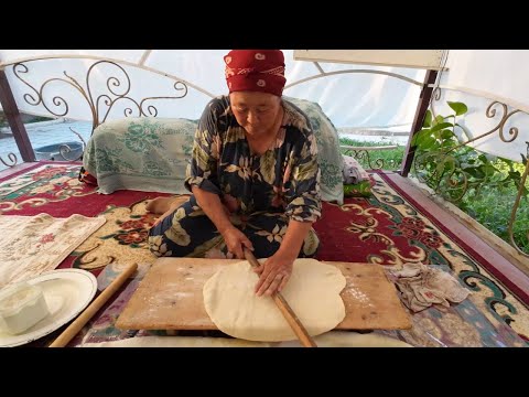 Kyrgyz lady making Borsok (fried puffed bread) the traditional way