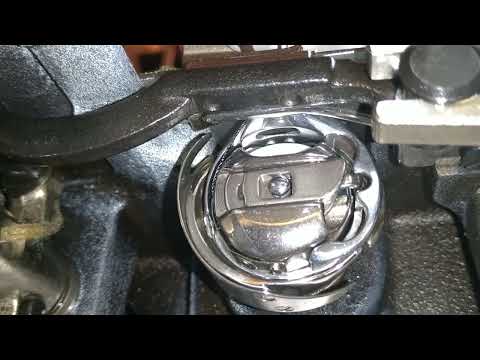 Aurora A-0302E, натяг верхней нитки при обводе шпульного колпачка 2