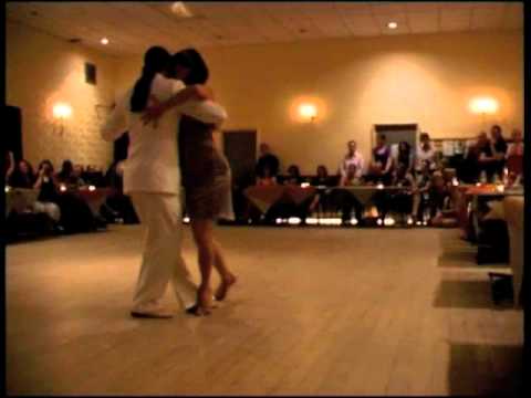  Adrian Costa  and  Amanda Costa  are  dancing  to  the  tango  "  Una Vez  "