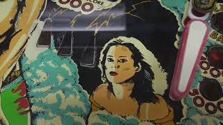 Repainting wear on a 1979 FLASH Pinball Machine Playfield - She's supposed to look like that!