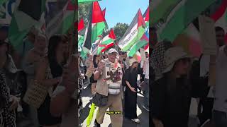 A Palestinian demonstrator leads chants for Gaza and Palestine during a solidarity protest for