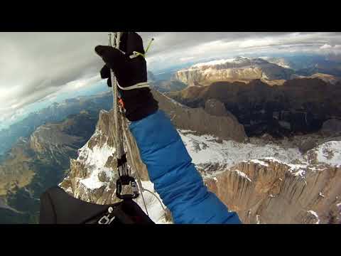 launching from top of the marmolada, punta penia with a paraglider.