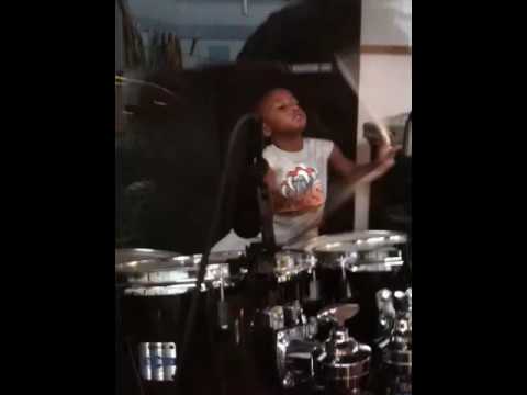 Naaji playing the drums... he's coming along since his air drum solo
