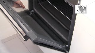 How do I clean my oven door?