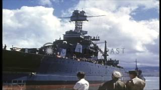 View from the dock towards USS California (BB-44) departing Pearl Harbor, Hawaii HD Stock Footage