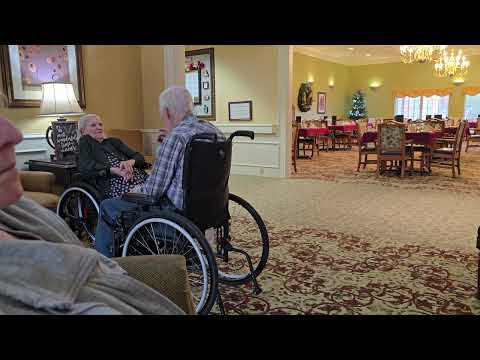 Bill offering Delores some chocolate