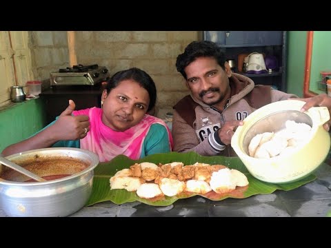 My Brother Eating Idly  With Chicken Gravy
