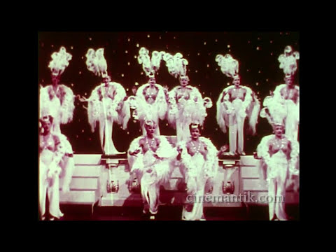 Trailer still highlighting chorus girls in elaborate costumes at the Diamond Horseshoe