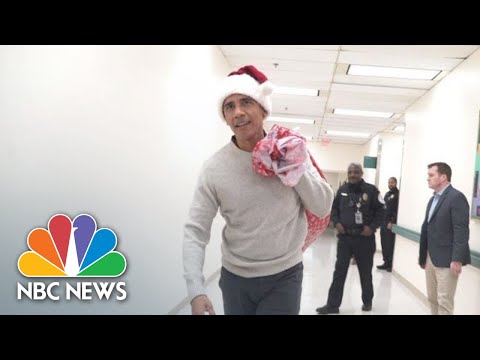Barack Obama Delivers Holiday Gifts Wearing Santa Hat At Children’s Hospital | NBC News thumnail