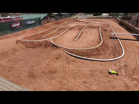 Tekno EB410.2 1/10th R/C Buggy Running Practice Laps On Small Race Track With Loose Dirt / Clay