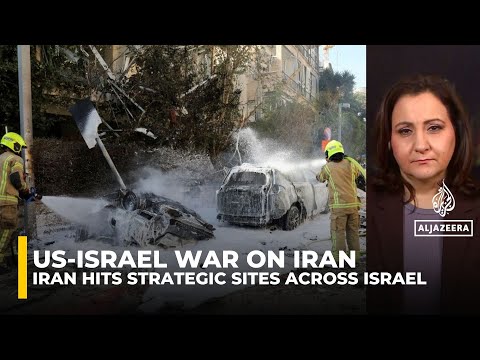 Iran missiles hit strategic sites across Israel, fires reported