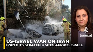 Iran missiles hit strategic sites across Israel, fires reported