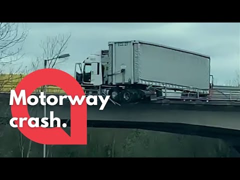 This video shows the aftermath of a crash on the M25 that left a lorry hanging off a bridge | SWNS