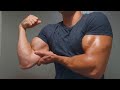 Young stud flexing huge shredded muscles after workout