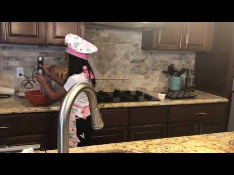 Nasreen El-Shabazz baking an cake