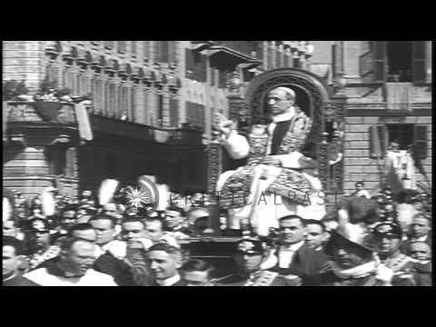 A large crowd gathers for religious ceremonies as Pope Pius XII takes over the Sa...HD Stock Footage