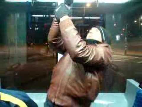 nikola tosic doing one arm pullup in amsterdam tram