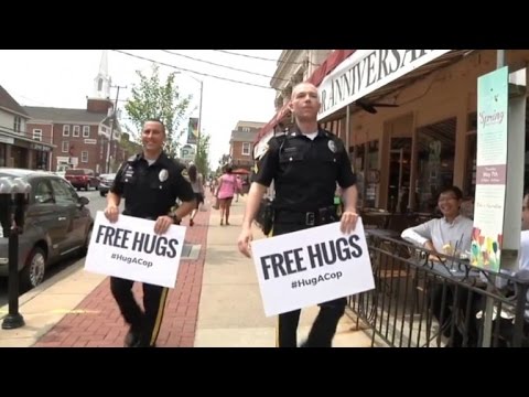 What Happens When Two Police Officers Offer Free Hugs
