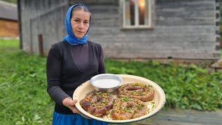 THE WOMAN LIVES ALONE IN THE MOUNTAINS. COOKING POTATO SAUSAGES
