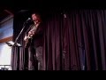 John Flynn performs "Two Wolves" at the One World Coffeehouse