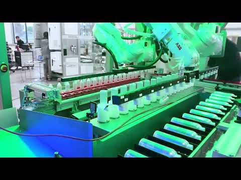 Compact bottle unscrambler with cleaning station, orientation and printing module